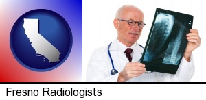 a radiologist looking at an x-ray image in Fresno, CA