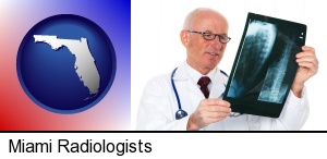 a radiologist looking at an x-ray image in Miami, FL