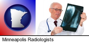 a radiologist looking at an x-ray image in Minneapolis, MN
