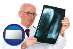 south-dakota a radiologist looking at an x-ray image