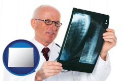 wyoming a radiologist looking at an x-ray image