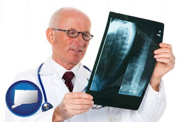 a radiologist looking at an x-ray image - with Connecticut icon