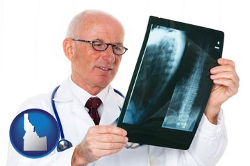 a radiologist looking at an x-ray image - with Idaho icon
